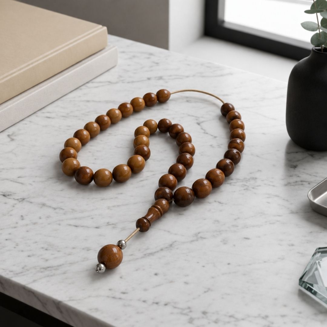 Brown beaded strand on marble