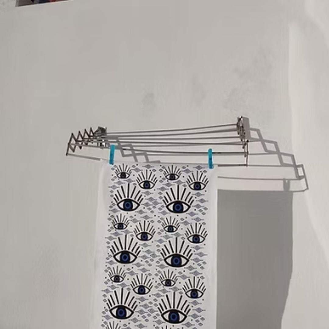 Blue Eye Cotton Tea Towel – screen-printed Greek evil eye design in blue and black on white cotton, styled hanging view | Thalassea