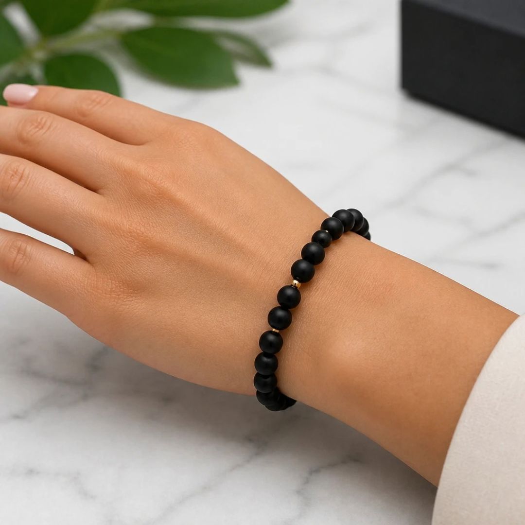 Black bracelet worn on wrist
