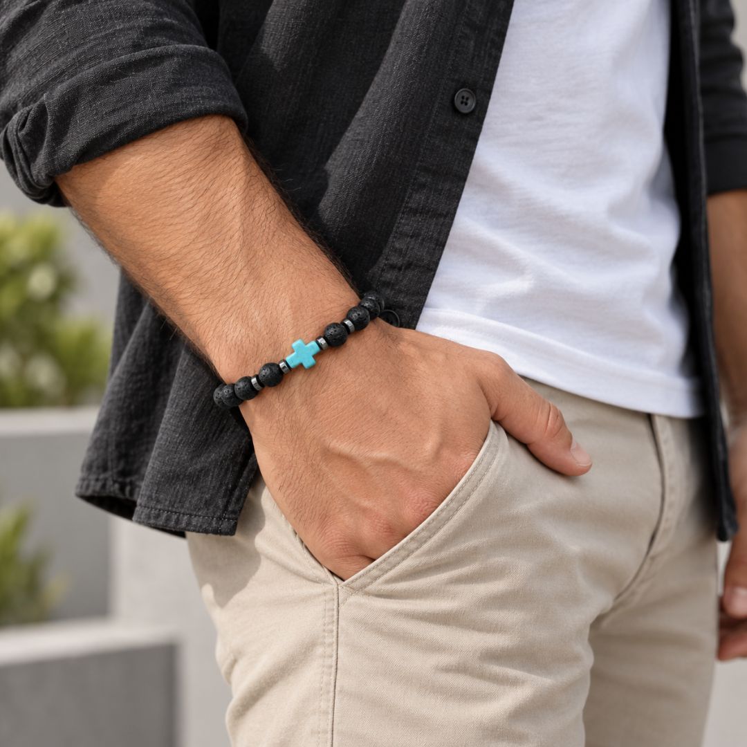 Man wearing turquoise cross bracelet
