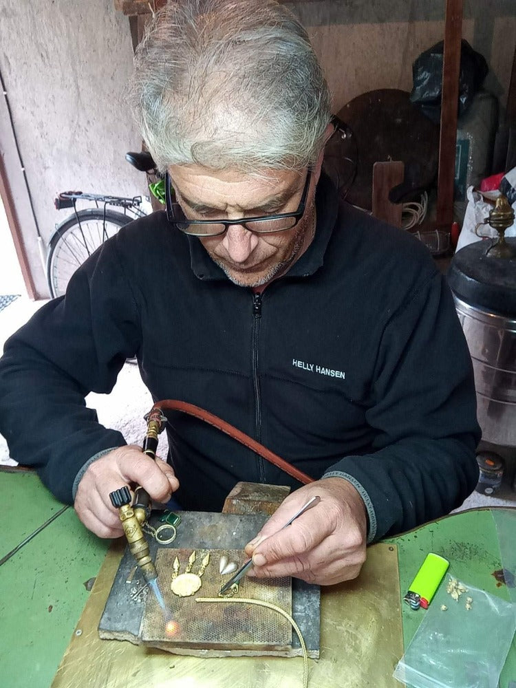 Man working on jewelry in a workshop