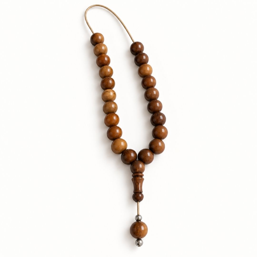 Brown round beads with carved end