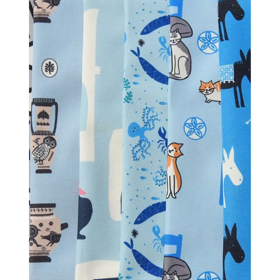 A Hue of Greek Blue water-resistant aprons in assorted Greek designs, detail view | Thalassea