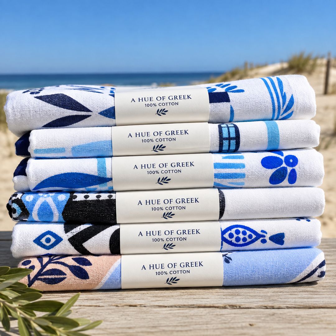 Stacked A Hue of Greek Blue cotton tea towels in paper wrap, styled | Thalassea