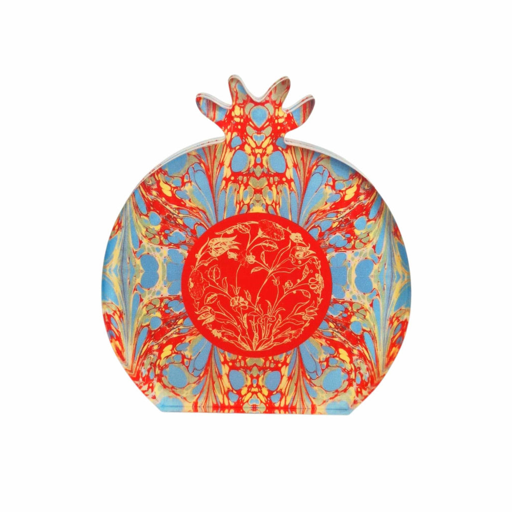 Decorative plate with red floral design and colorful abstract patterns on a white background