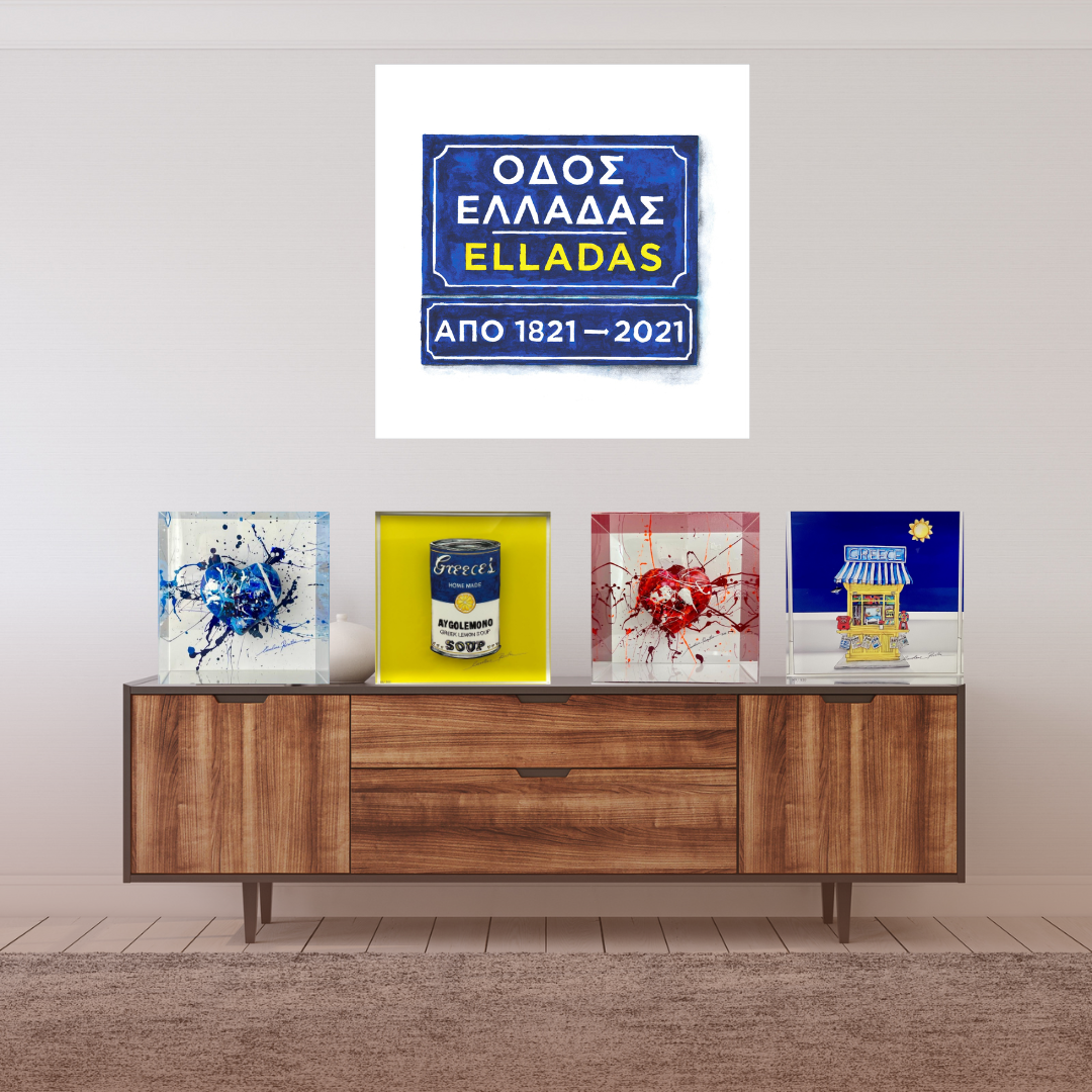 Clear acrylic blocks with a miniature model of a Greek street stall on a bench