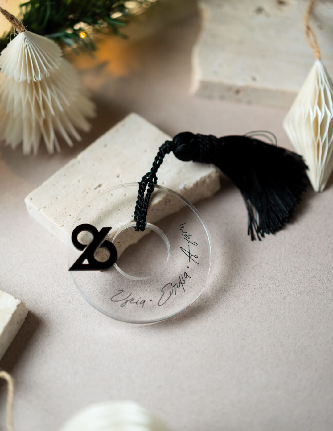 Decorative item with tassel on a light surface