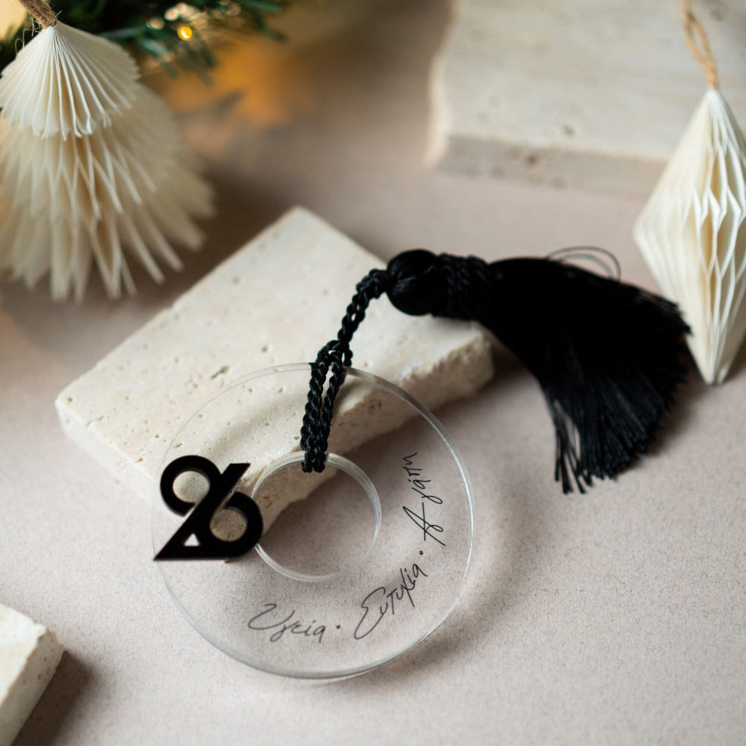 Decorative item with tassel on a light surface