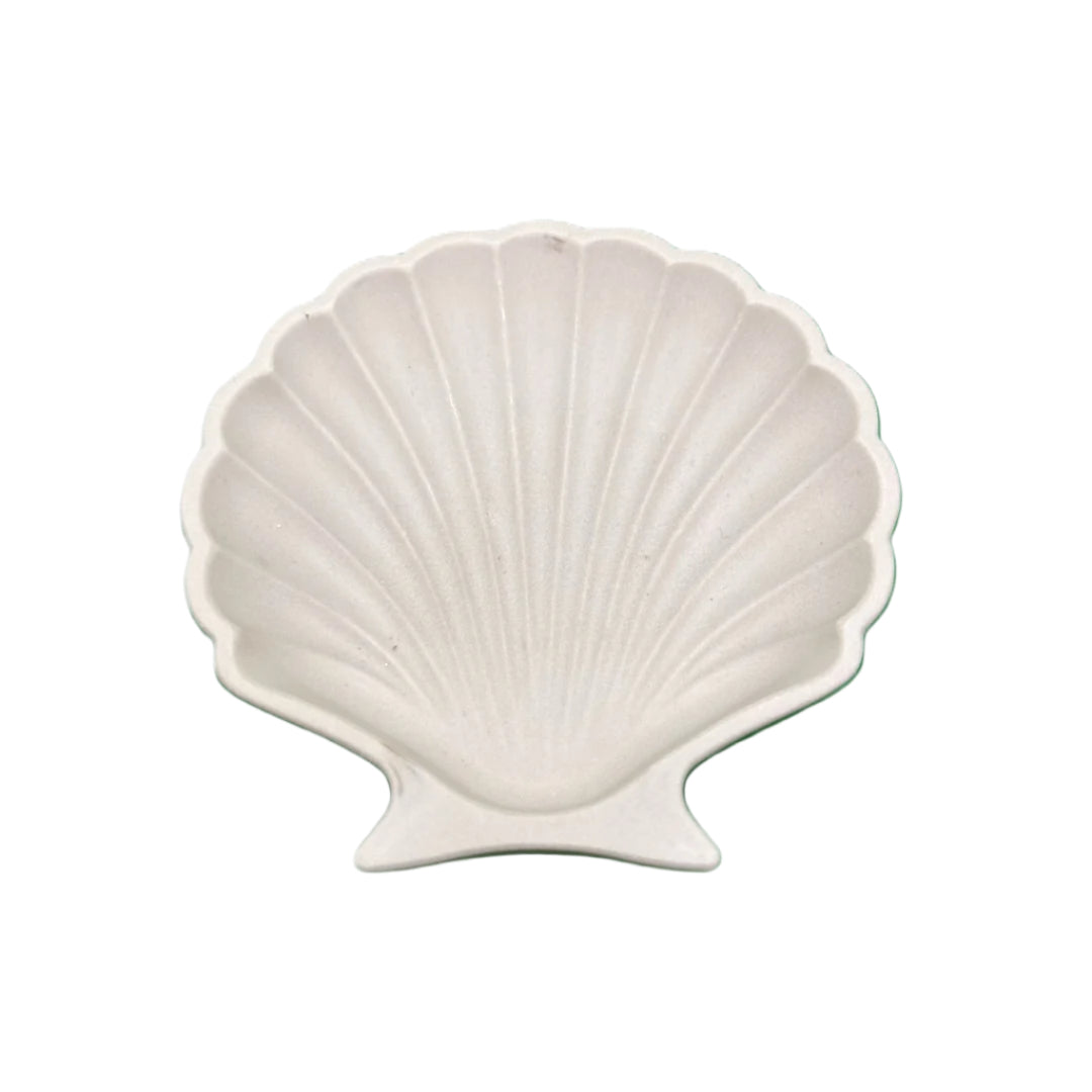 A beige ceramic shell-shaped plate, handcrafted in Crete, Greece.