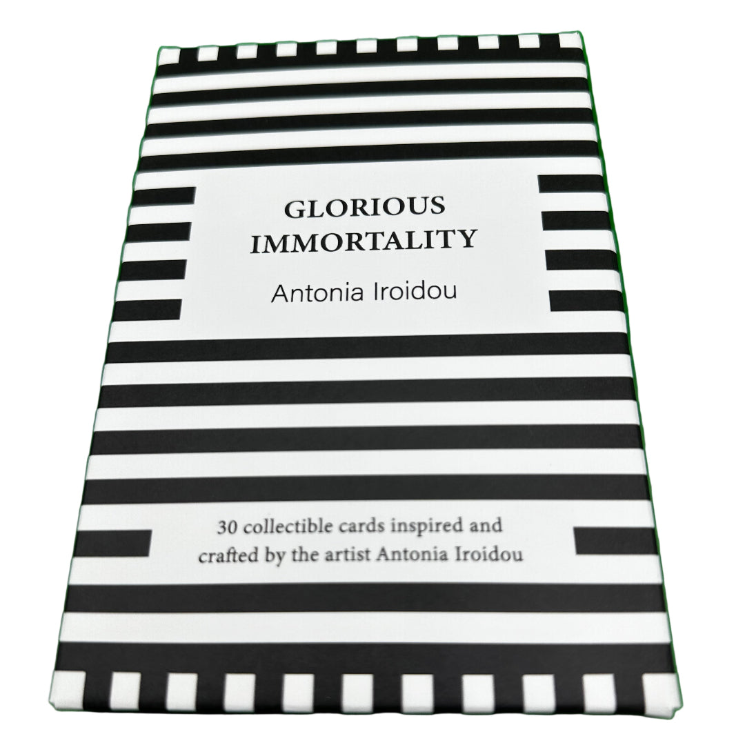 Book with black and white striped cover on a green background