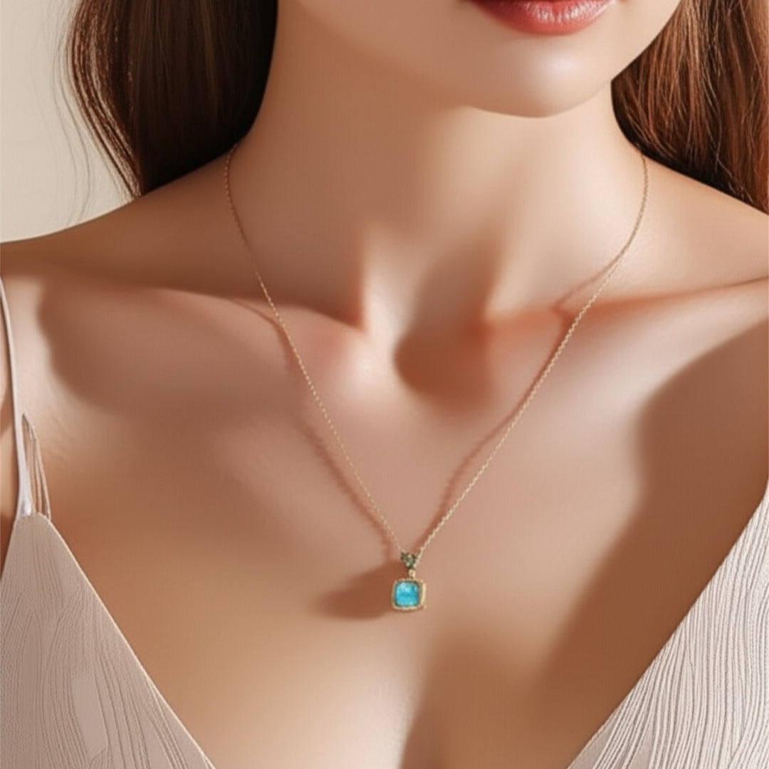 Necklace with a blue pendant worn by a model