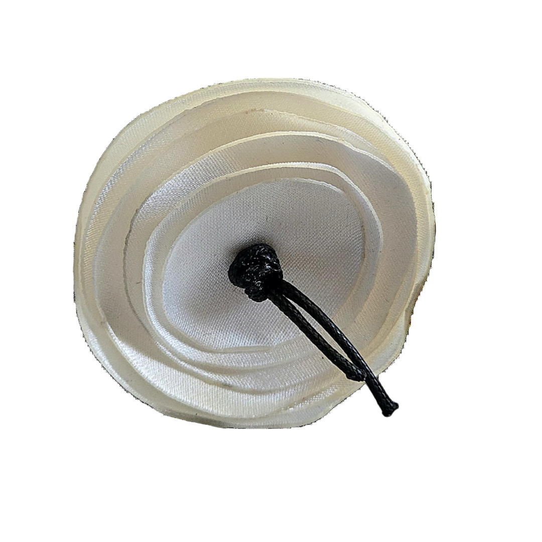 Close-up of a white filter with a black metal rod on a white background