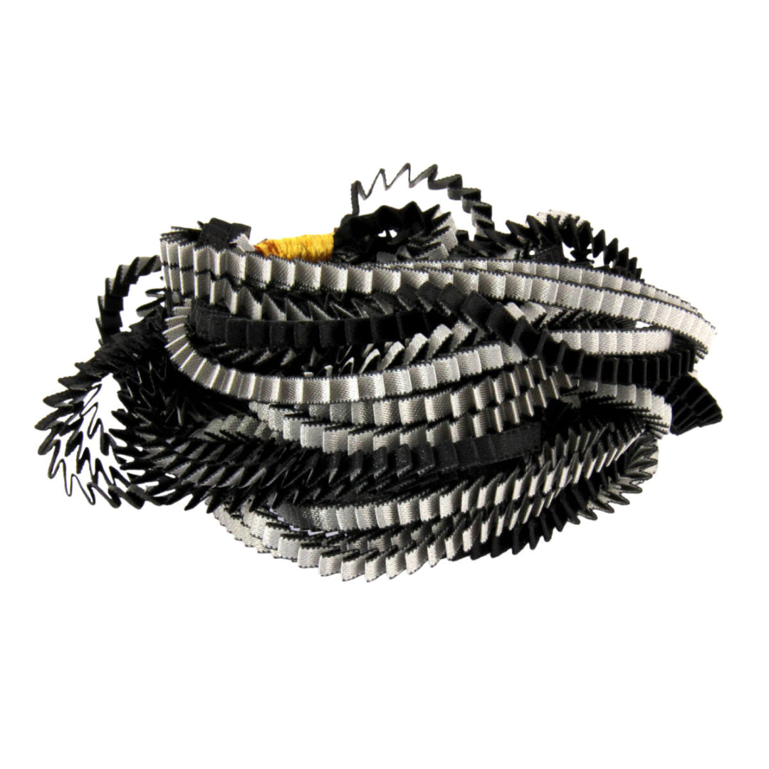 Stack of black and white ribbons on a white background