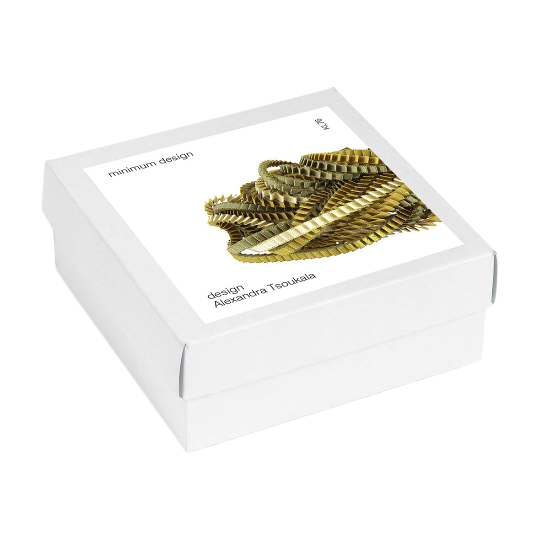 White jewelry box with gold bracelet design on a white background