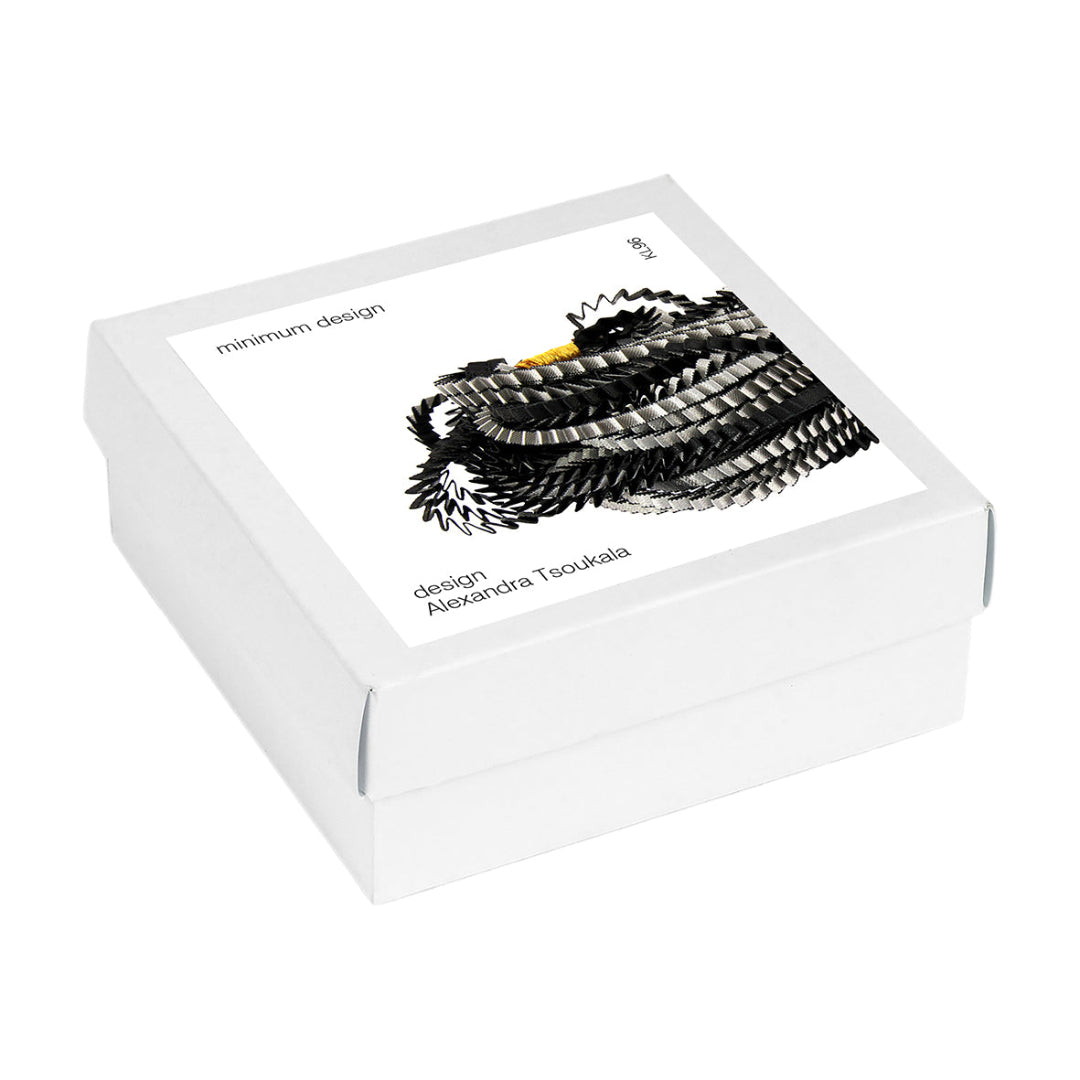 White jewelry box with a black and white illustration on a white background