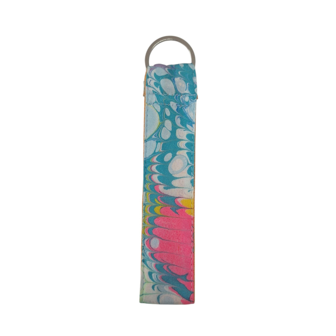 Colorful marbled keychain with a metal ring on a white background