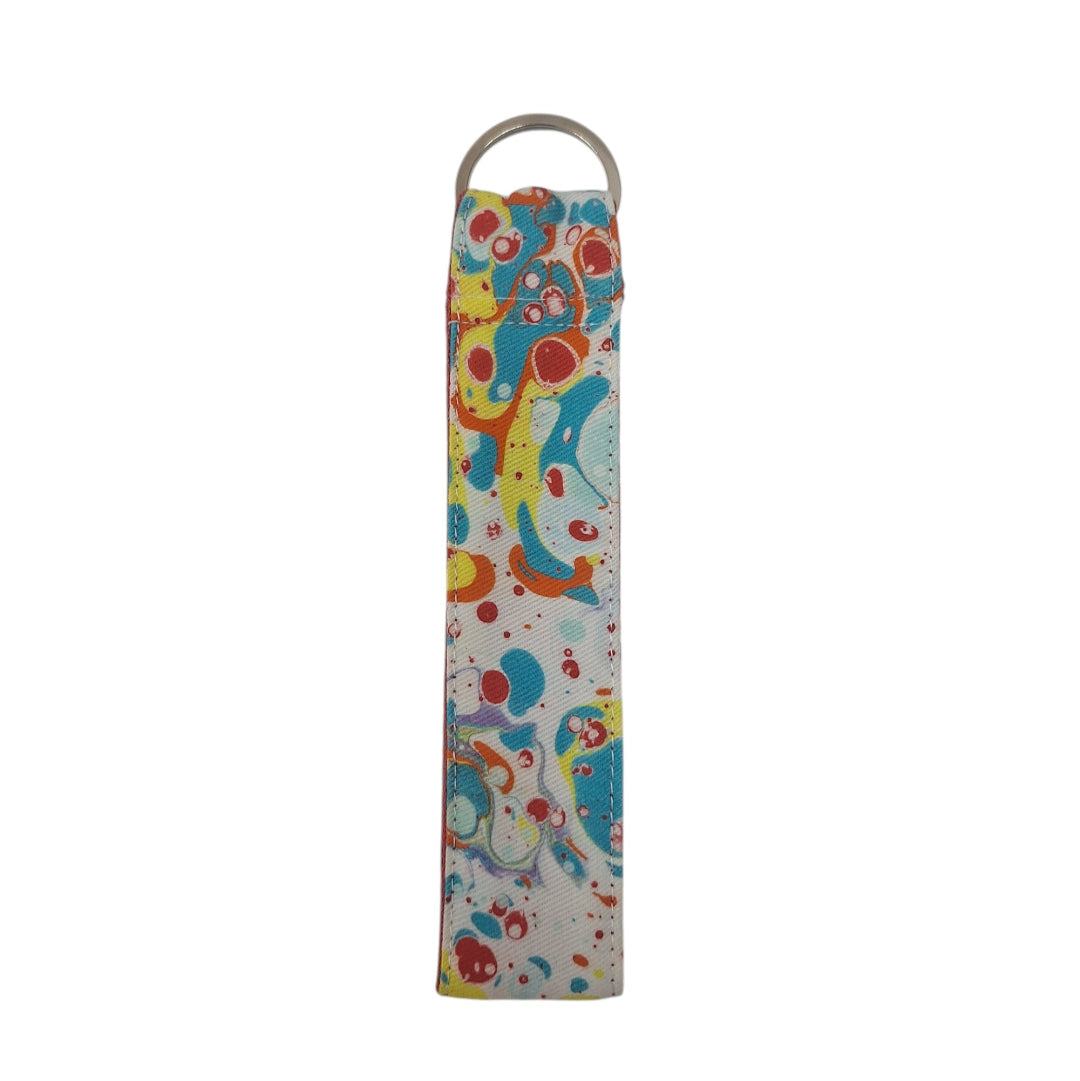 Colorful fabric strap with a pattern on a white background