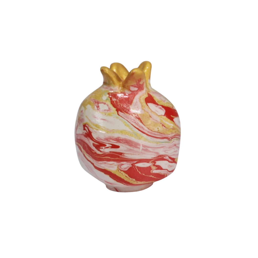 Marbled ceramic vase with gold accents on a white background