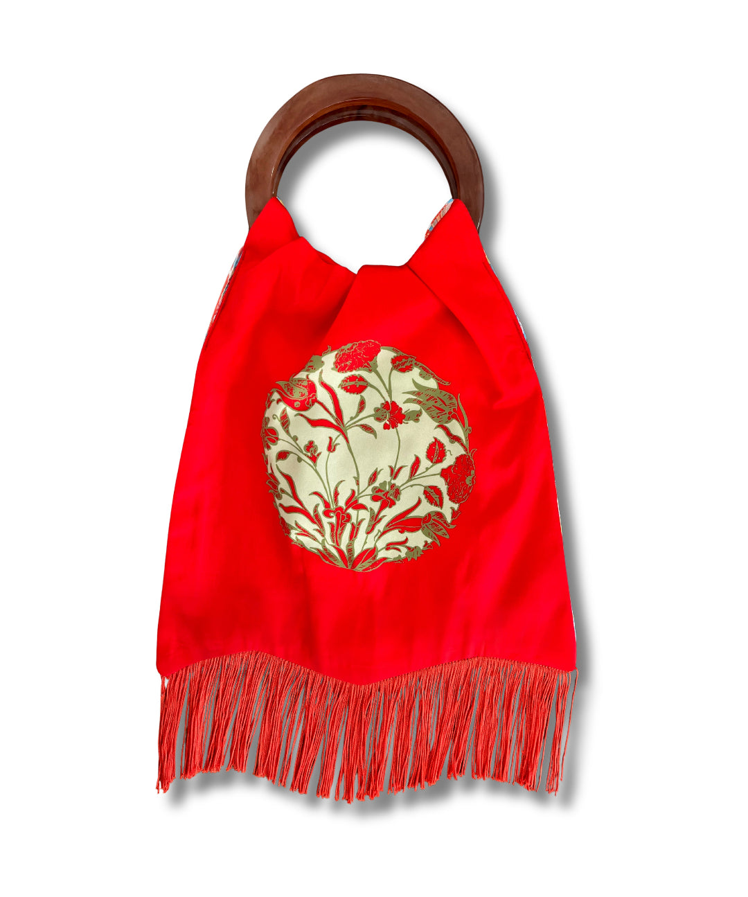 Red bag with floral design and wooden handle on a white background