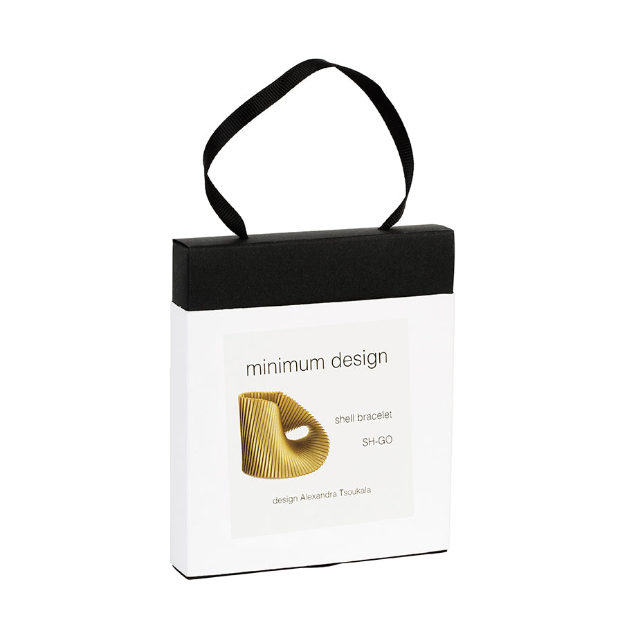White packaging box with black handle featuring 'minimum design' and product details on a white background