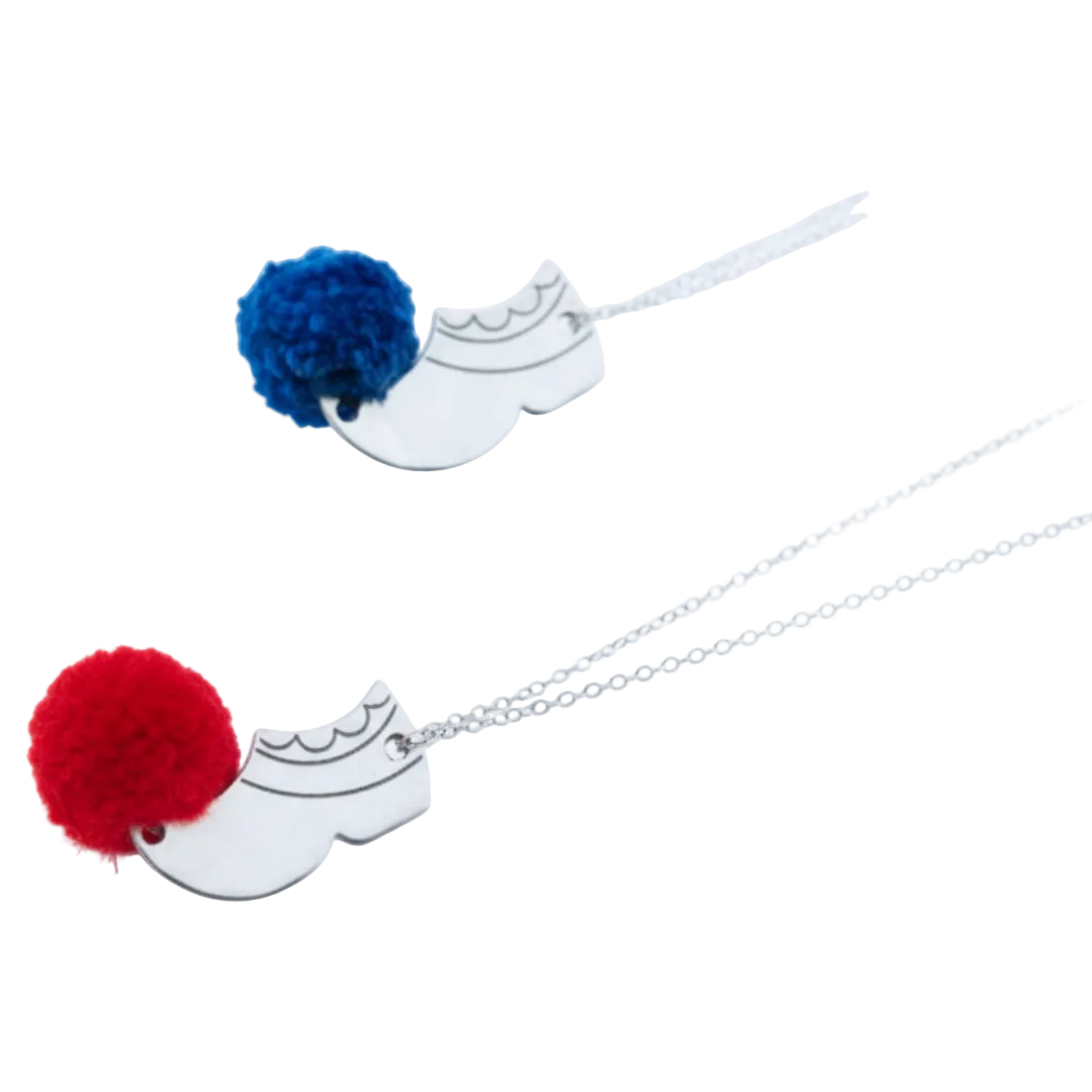 Necklace with blue and black pom-poms on a white background
