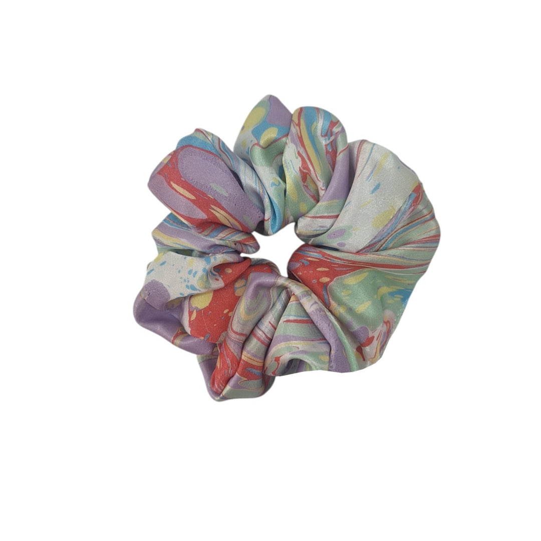 Multicolored marbled scrunchie on a white background