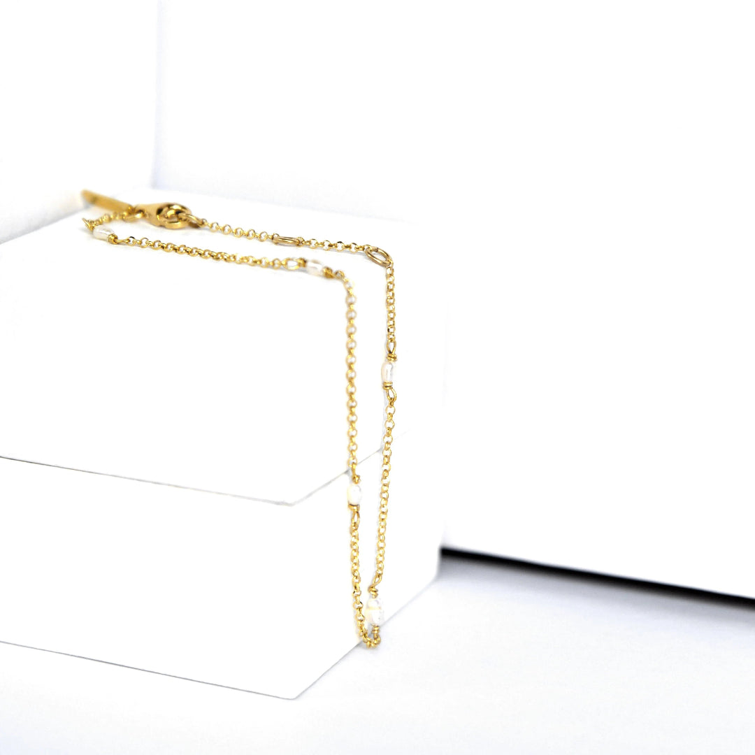 Gold chain necklace on a white background