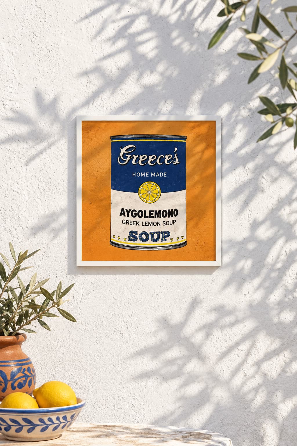 Avgolemono Orange (Small Prints Collection) – Greek pop art soup can print by Caroline Rovithi, framed on a white wall with a bowl of lemons, styled | Thalassea