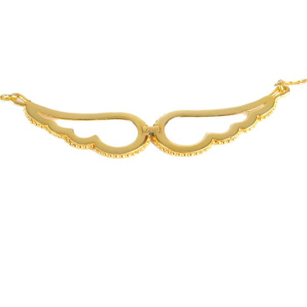 the back of an 18K gold pendant in the shape of angel wings attached to a gold chain.