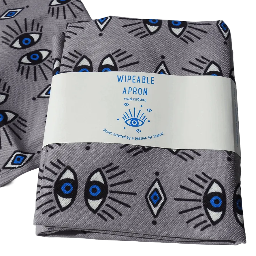 A folded gray wipeable apron with a blue and black eye pattern, wrapped in a white paper band that reads 'WIPEABLE APRON' in blue text.