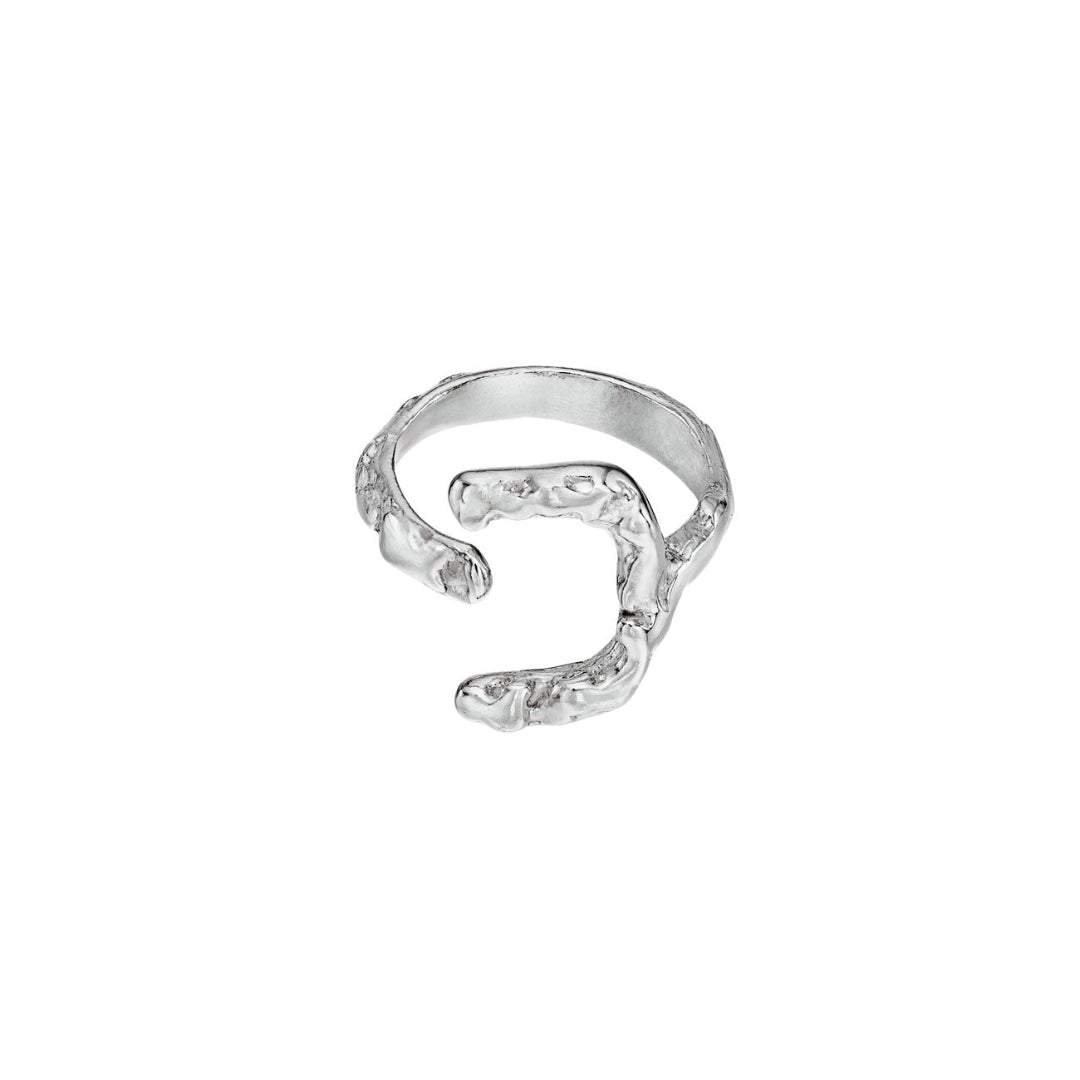 Silver ring with a wavy design on a white background