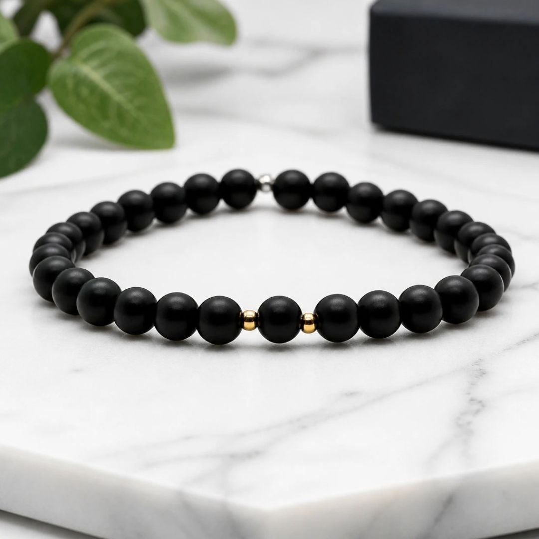 Black bead bracelet gold accents