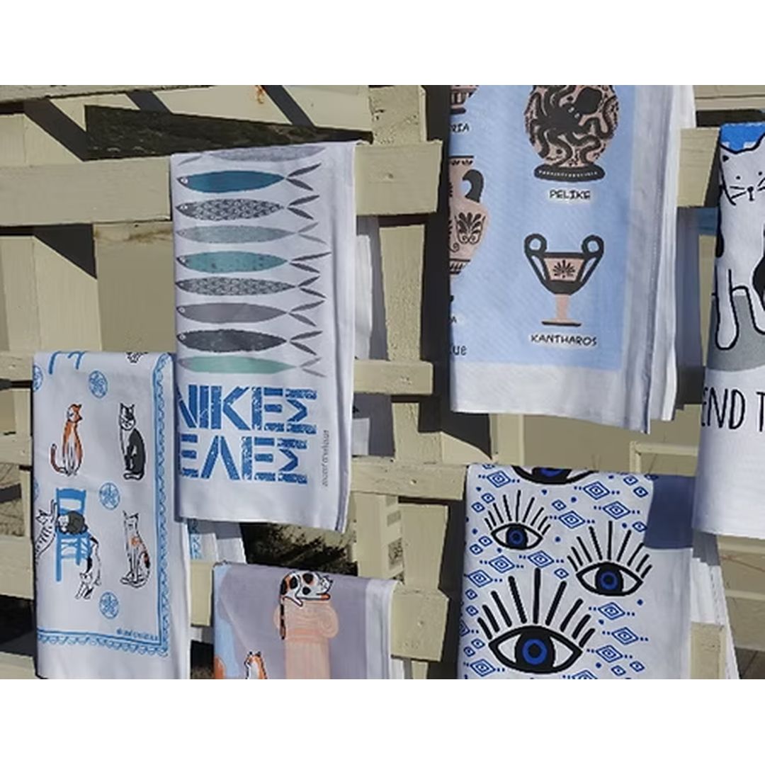 A Hue of Greek Blue cotton tea towels on display, including the Blue Eye design, styled | Thalassea