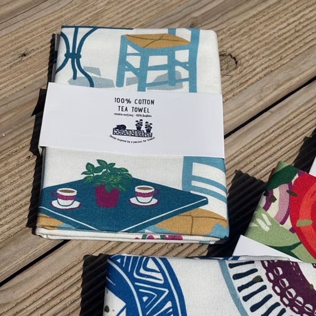 Coffee and Drinks Cotton Tea Towel – folded in its 100% cotton card wrap showing a Greek coffee table, packaged view | Thalassea