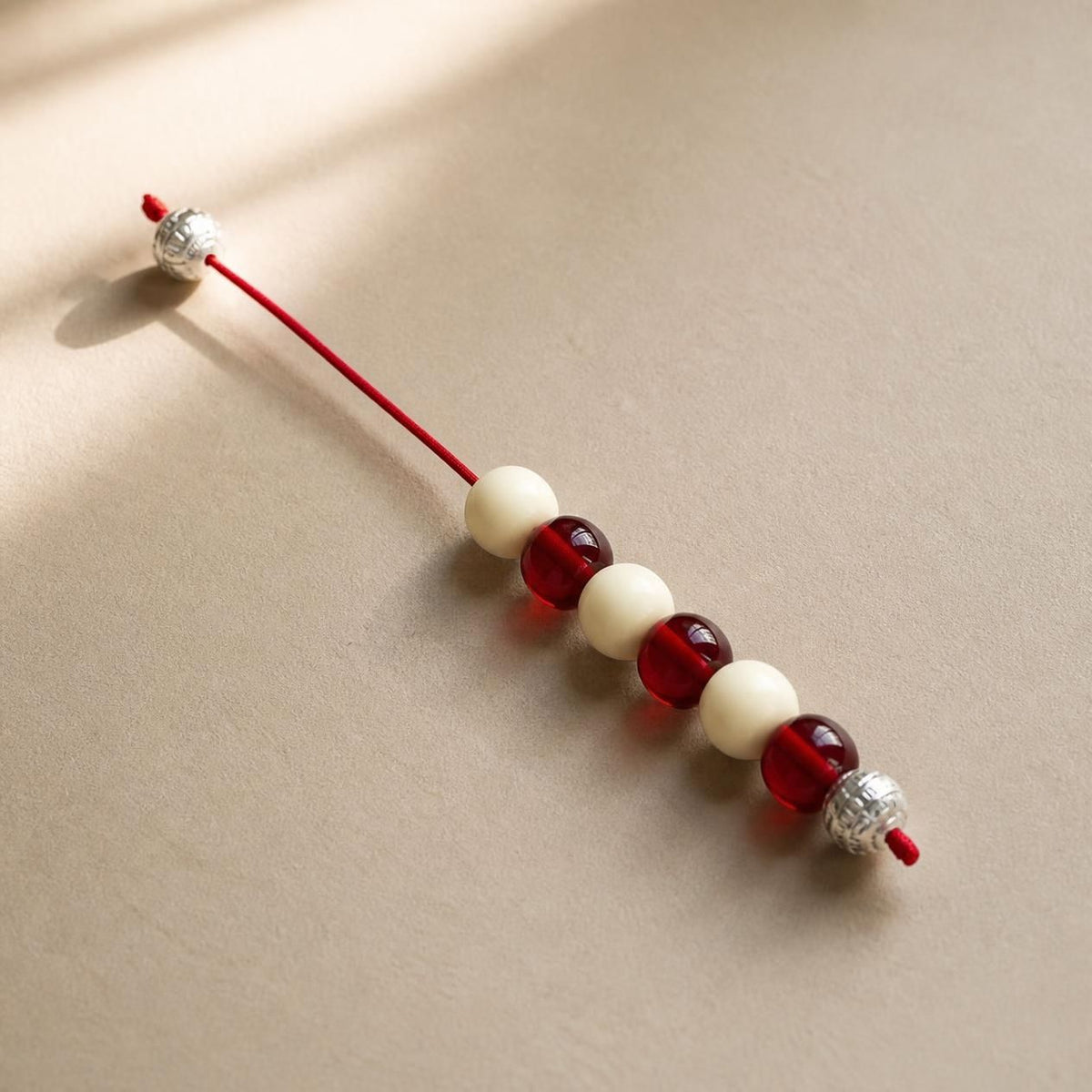 Red & Ivory Resin Beglery