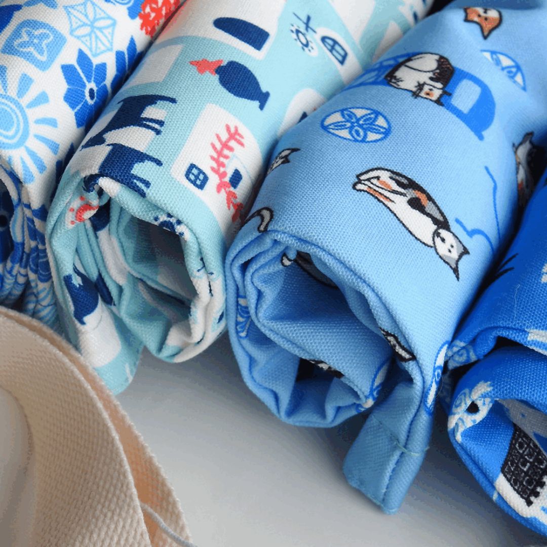 Rolled blue cat print aprons