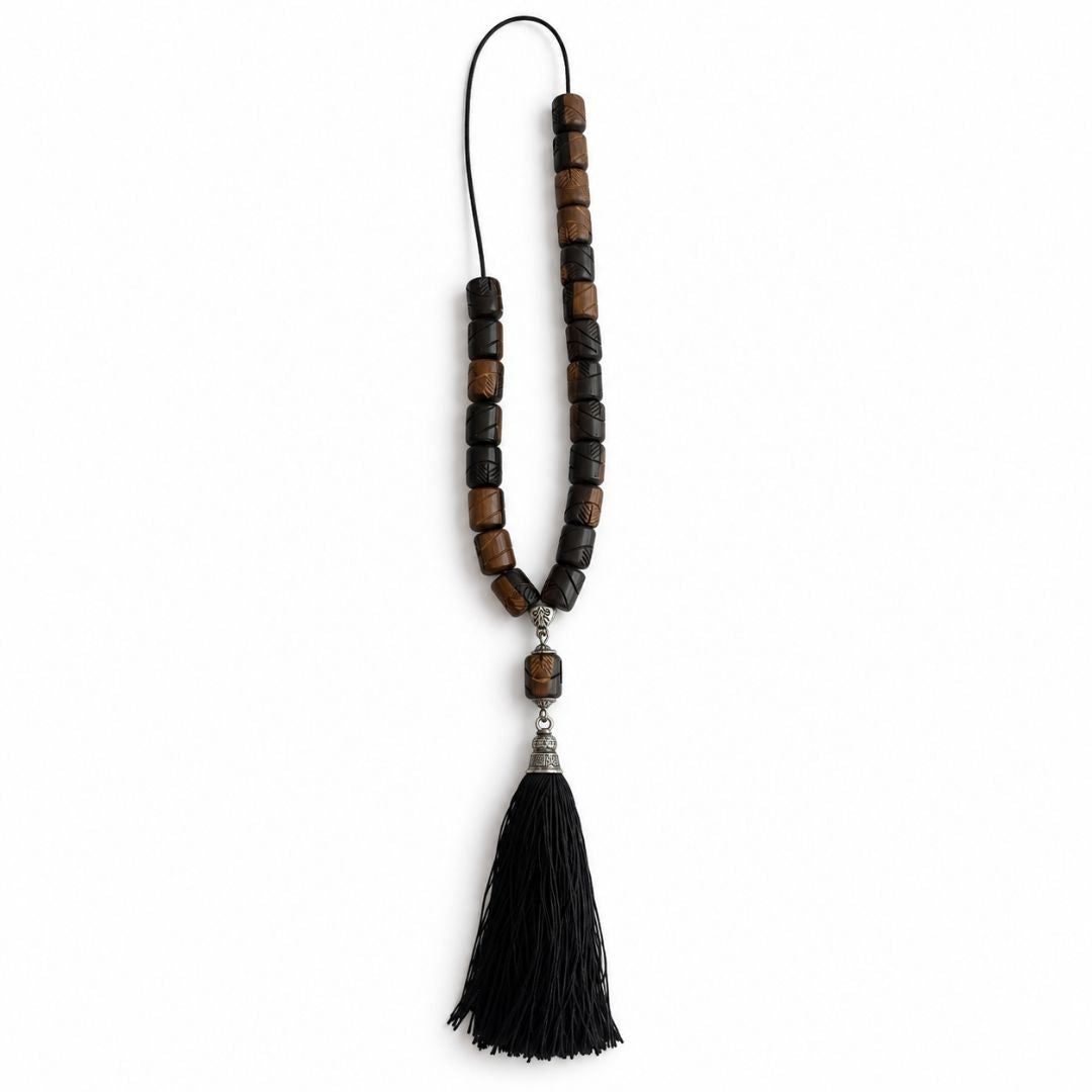 Carved beads with black tassel