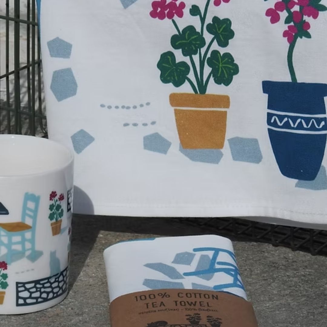Coffee and Drinks Cotton Tea Towel – potted geraniums print detail with wrapped towel and Greek café mug, detail view | Thalassea