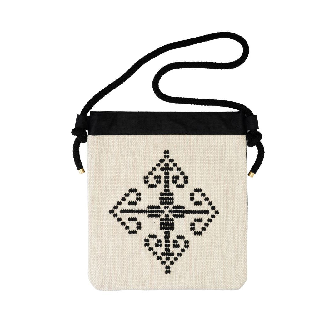 Tagari Milopotamos – handwoven Greek cotton crossbody bag, cream front with black patania motif | Thalassea
