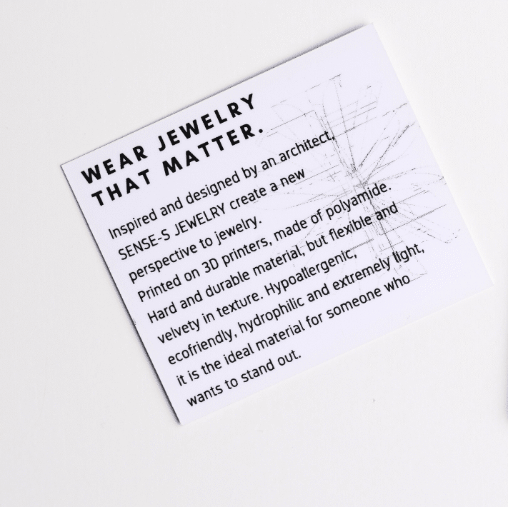Senses Jewelry packaging with a card on a white background
