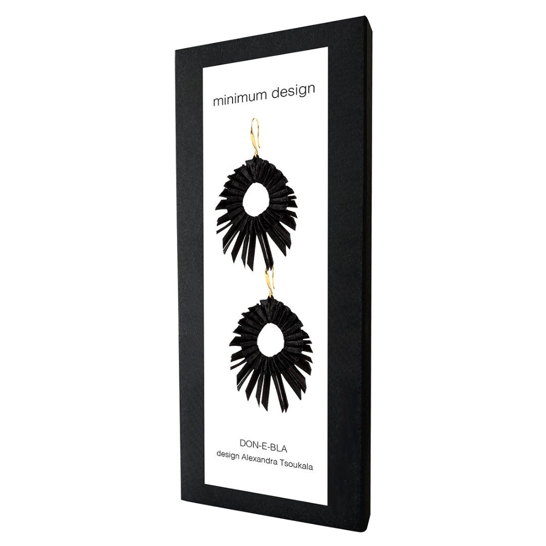 Black earrings on a 'minimum design' branded card with white background