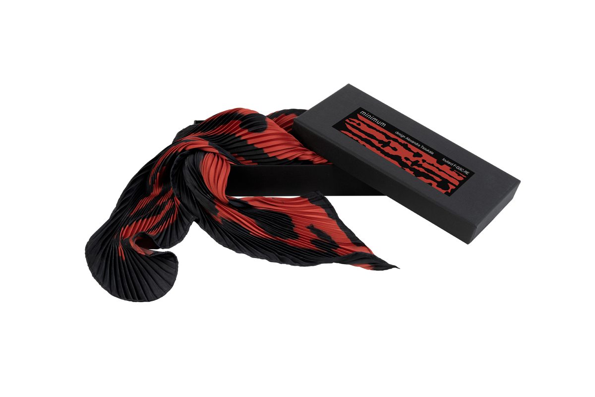 Black and red braided cable with a black rectangular block on a white background