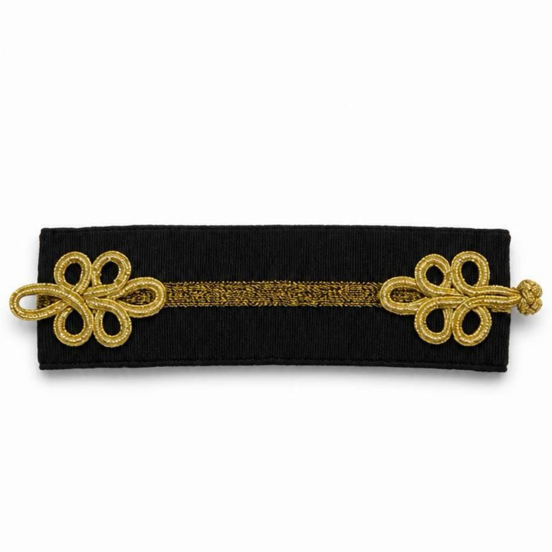 A dark brown leather girth with a textured alligator pattern, silver-toned metal buckles on both ends, and decorative silver emblems on the sides, shown against a plain white background.