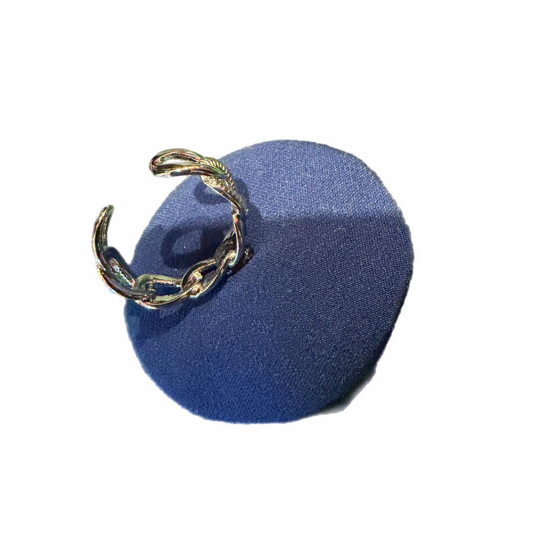 Blue circular object with a gold chain on a white background