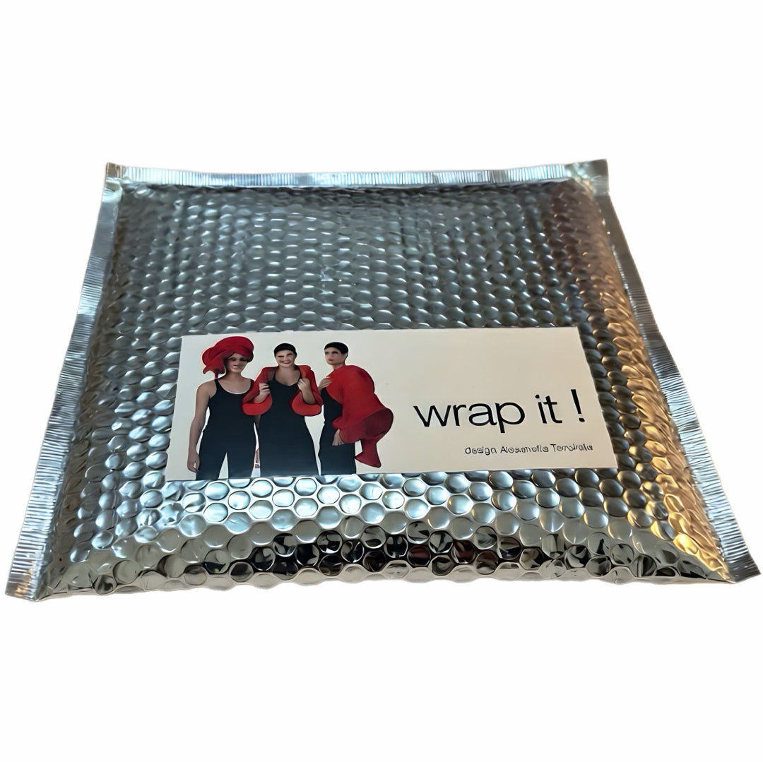 Silver bubble wrap envelope with 'wrap it!' branding on a white background
