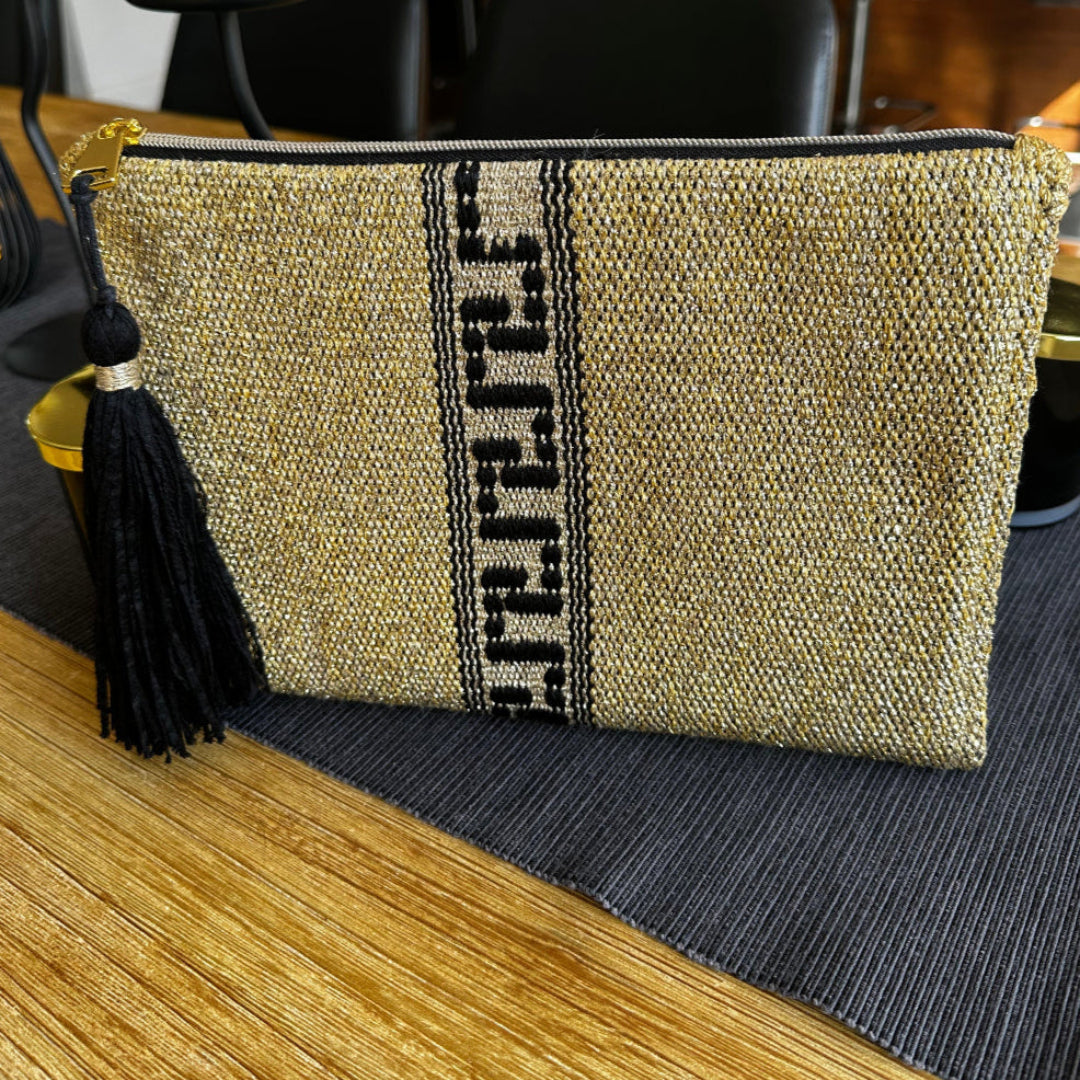 Decorative pillow with geometric pattern and tassel on a chair
