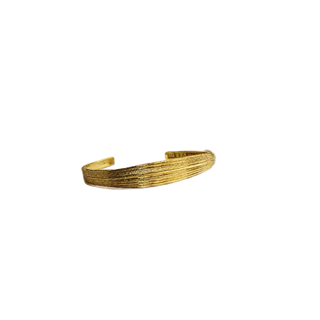 Gold bracelet on a white background