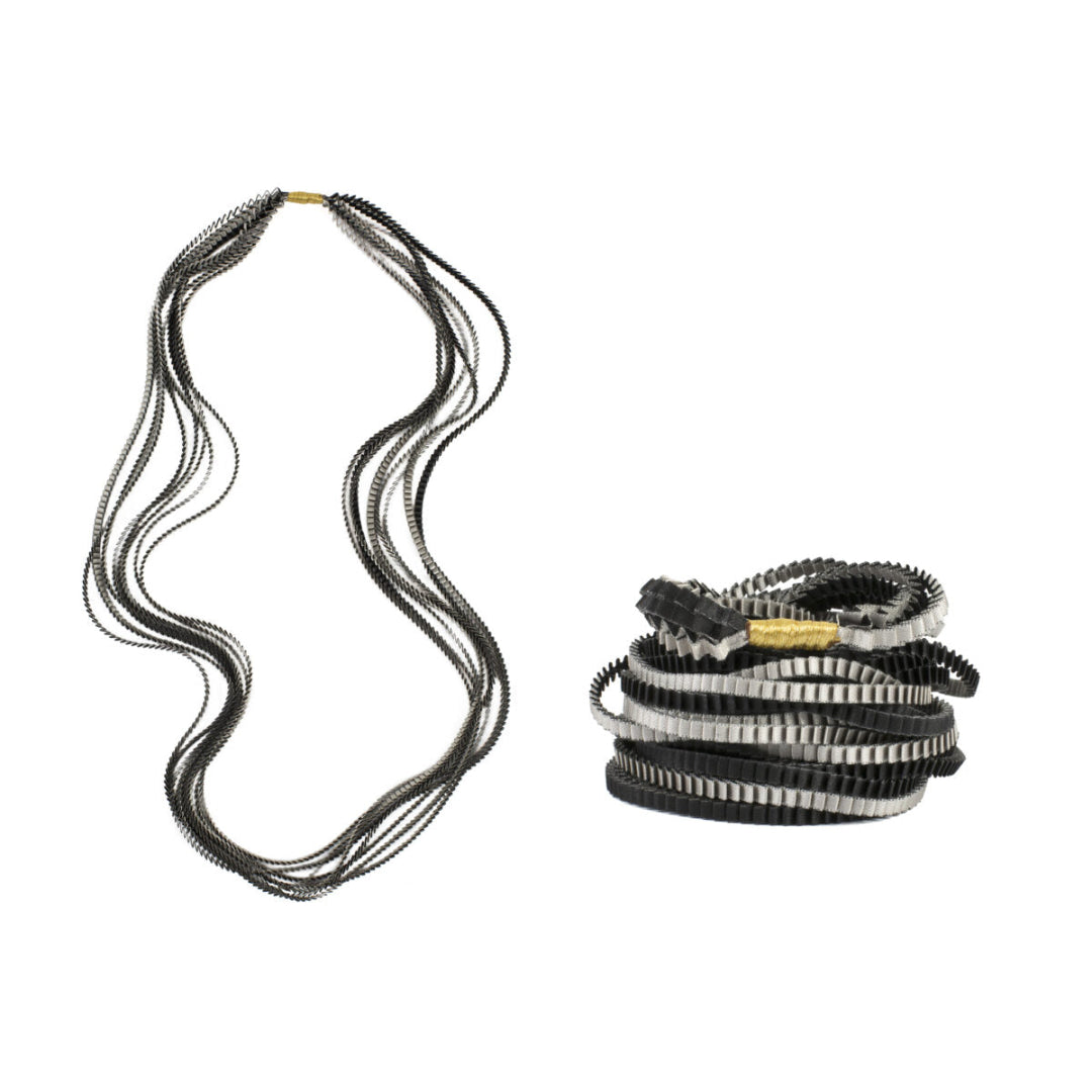 Set of black and silver belts on a white background