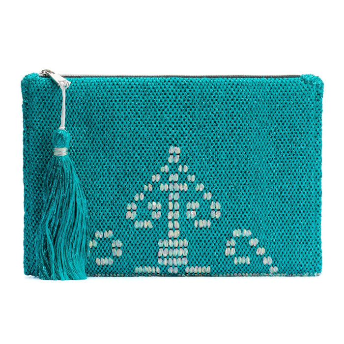 A blue handwoven clutch with an embossed geometric pattern and a tassel on the side.
