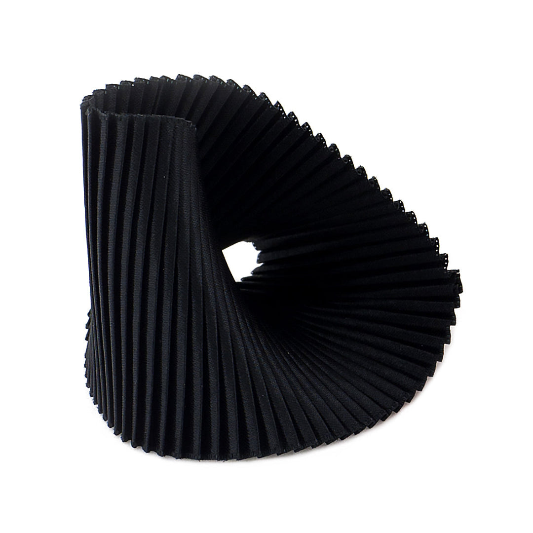 Black pleated ring on a white background